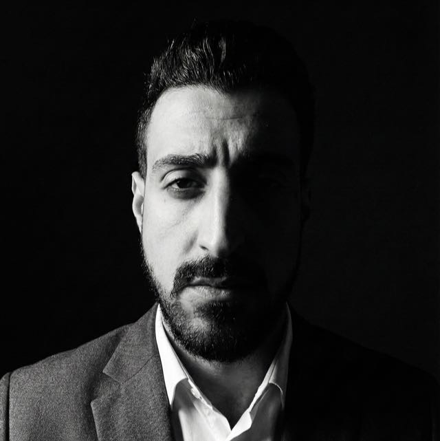 Black-and-white portrait of Malek Rifai